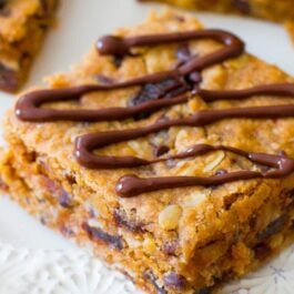 peanut butter chunk oatmeal bars on a white plate