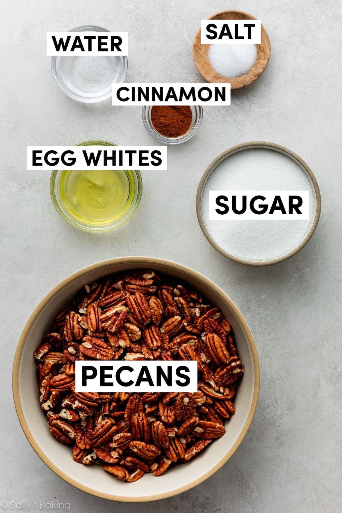 ingredients in bowls including sugar, egg whites, cinnamon, and salt.