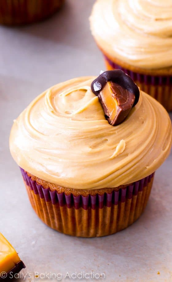 caramel cupcakes topped with salted caramel frosting and caramel candies