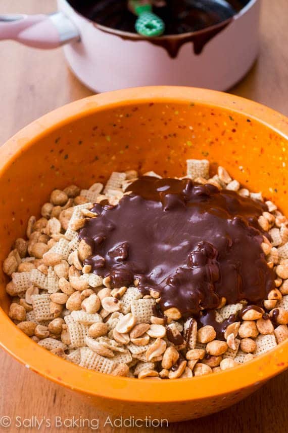 salted peanut Nutella puppy chow mixture in an orange bowl