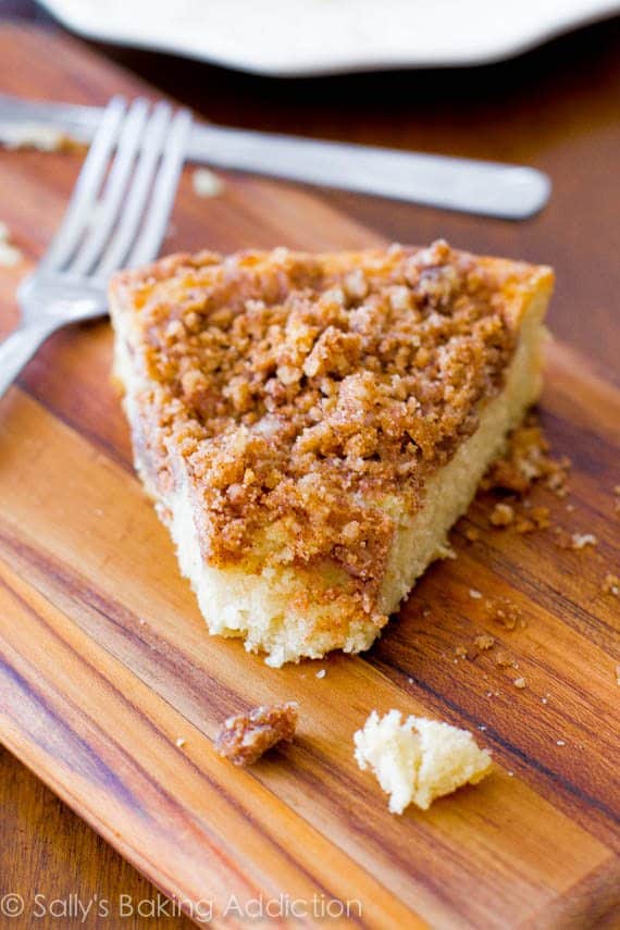 slice of super crumb coffee cake on a wood board