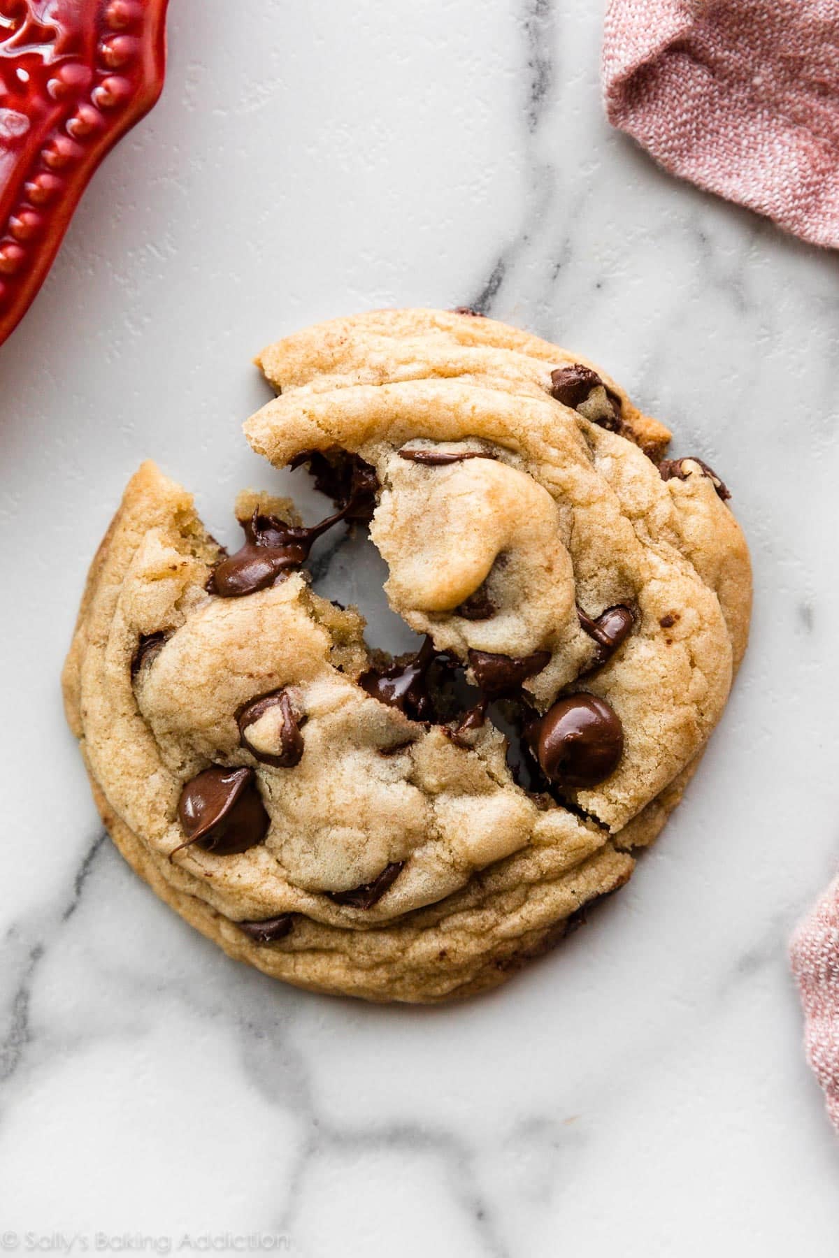 1 chocolate chip cookie broken in half