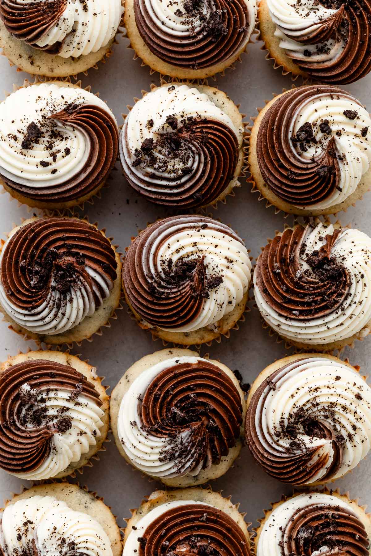 chocolate and vanilla swirled buttercream with crushed Oreo pieces on top.