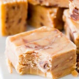 squares of peanut butter fudge with a bite taken out of one piece