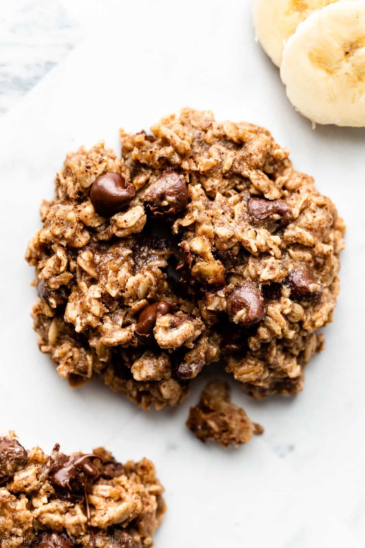 close-up overhead photo of banana chocolate chip breakfast cookie with oats.