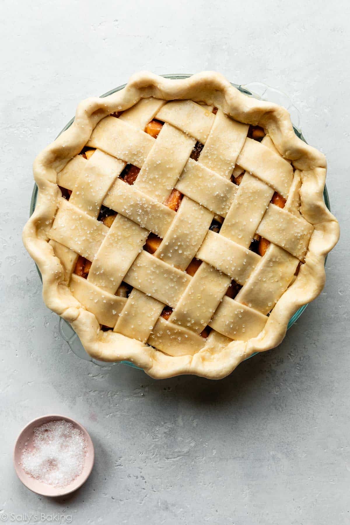 pie with fluted edges and lattice pie crust before baking.