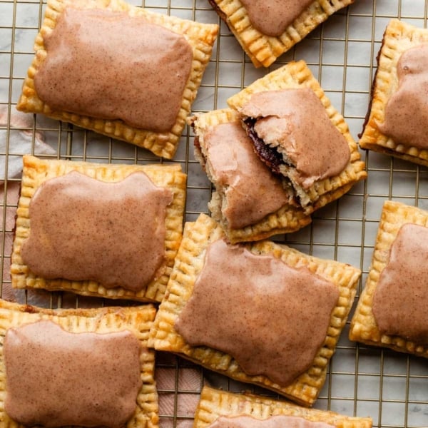 overhead photo of homemade brown sugar cinnamon pop tarts on gold cooling rack.