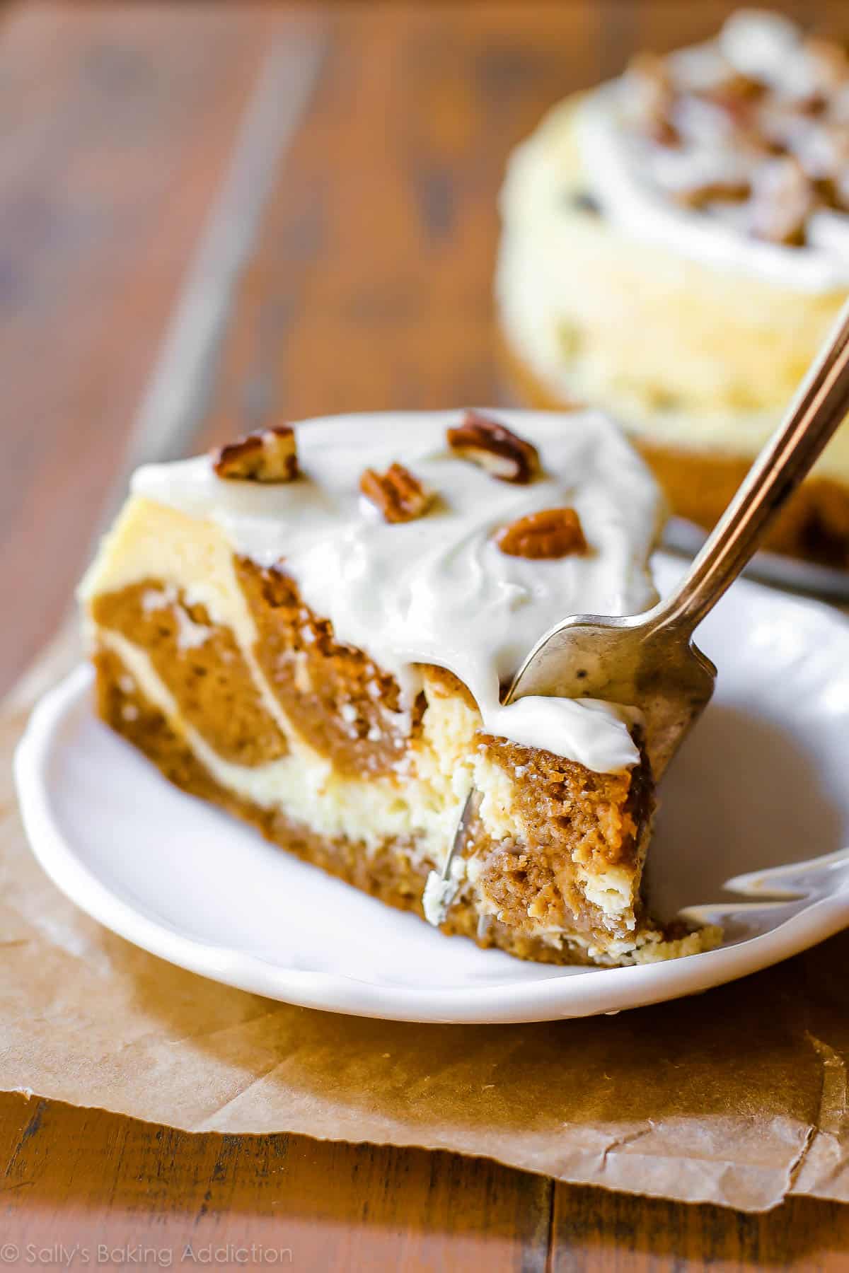 pumpkin cake cheesecake with a fork