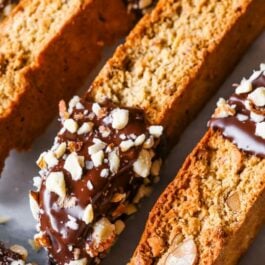 almond biscotti with part of each cookie dipped in chocolate