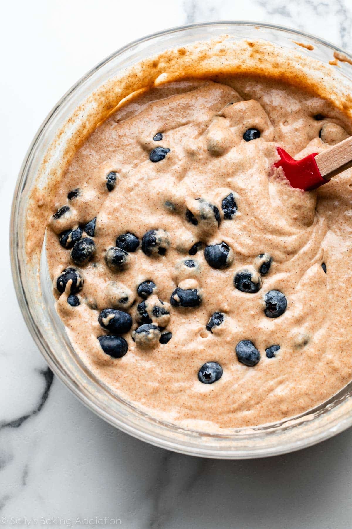bowl of batter with fresh blueberries.