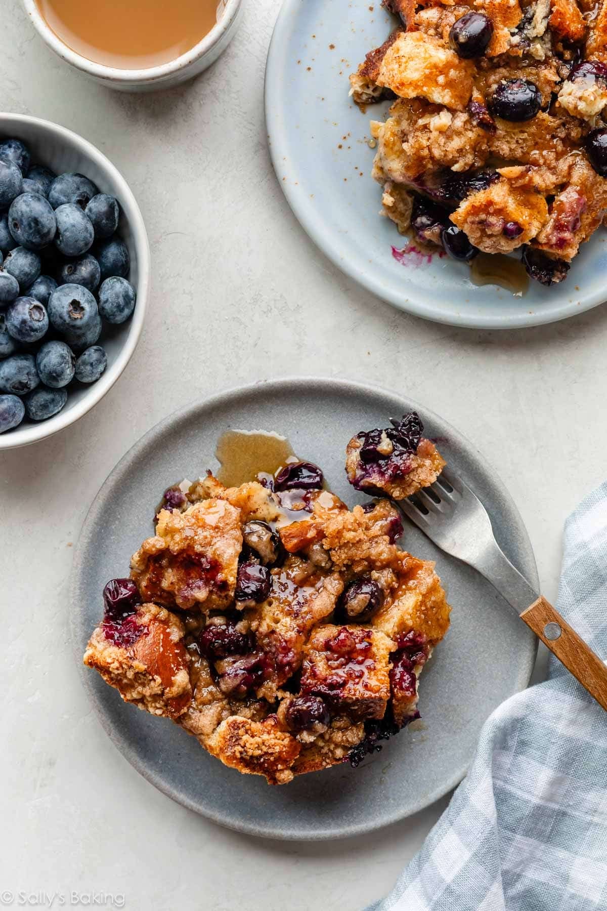 blueberry french toast casserole servings on small blue plates.