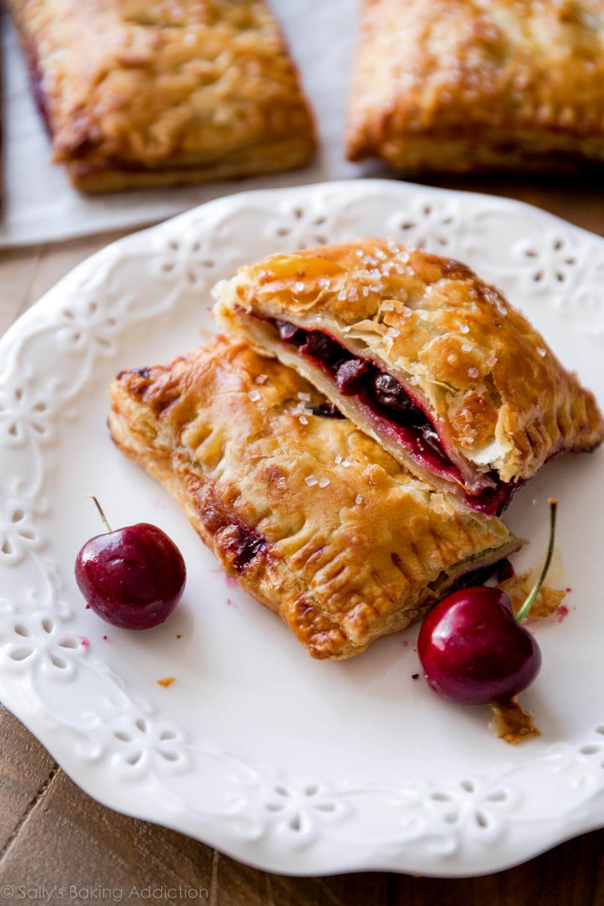 cherry pastry pies on a white plate