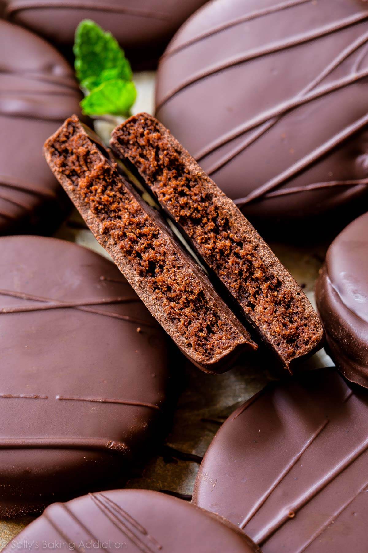 homemade thin mint cookie broken in half with the inside showing