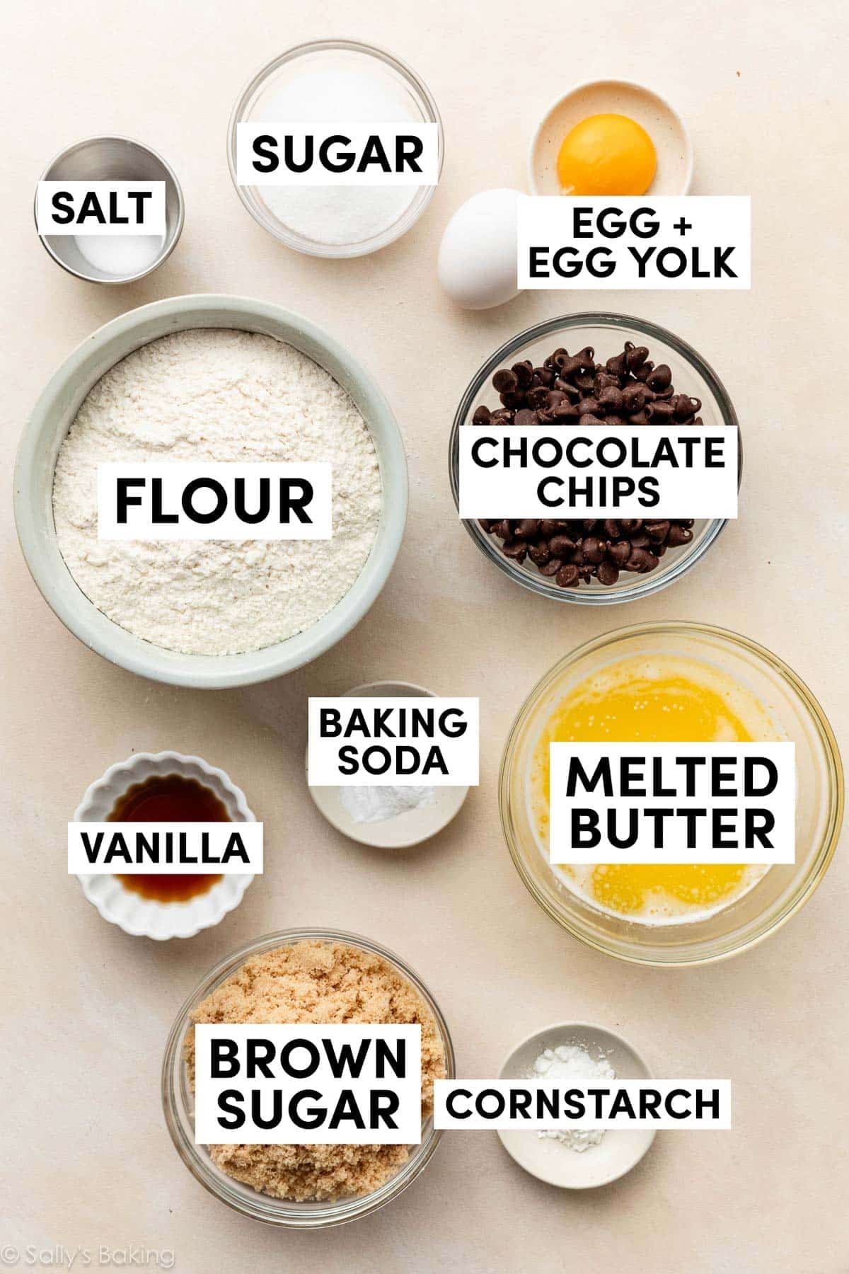 ingredients on counter including flour, egg, egg yolk, melted butter, brown sugar, cornstarch, vanilla, and baking soda.