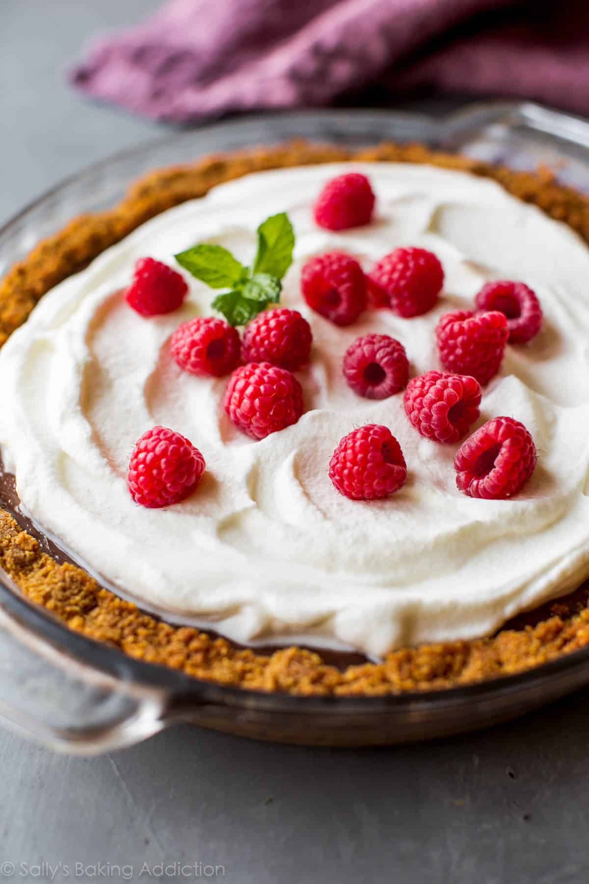 chocolate pudding pie in a glass pie dish