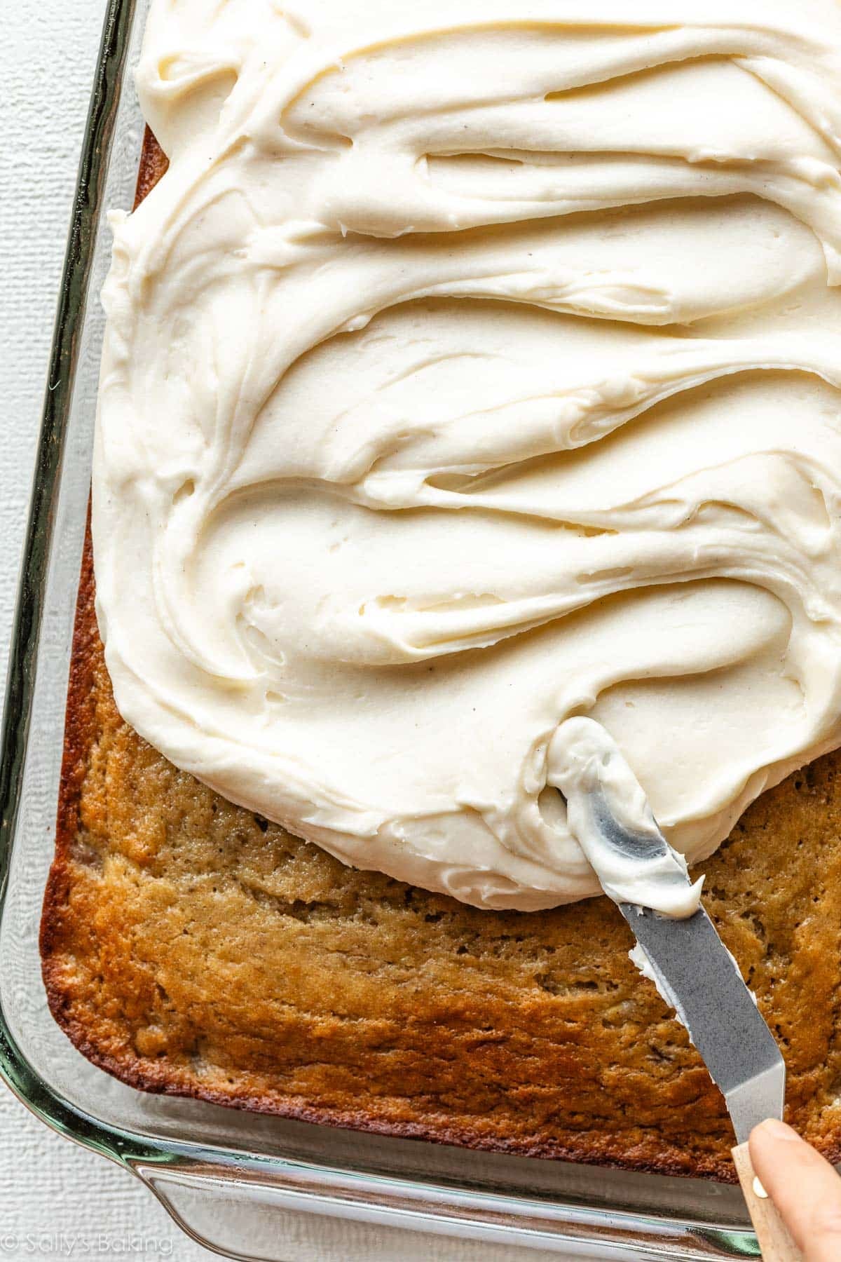 frosting sheet cake with cream cheese frosting.