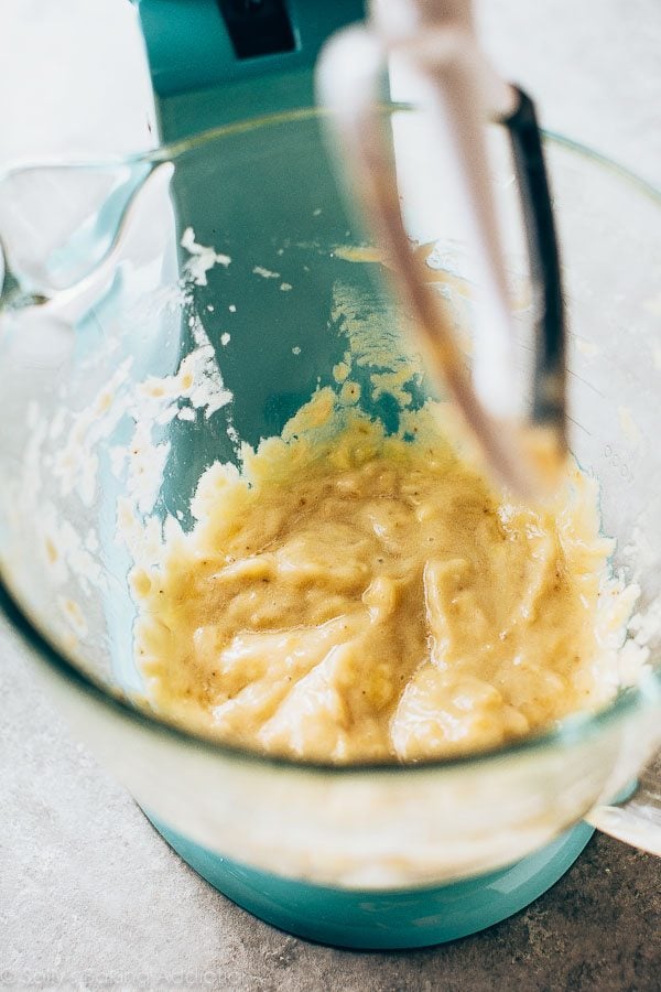 mashed bananas in a glass stand mixer bowl