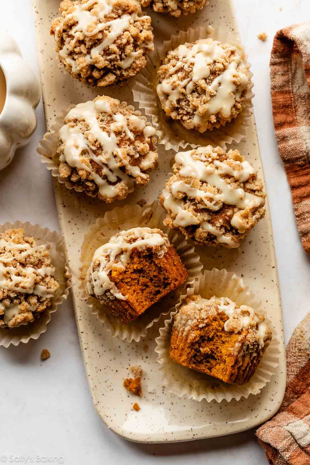 handmade platter with pumpkin crumb cake donuts on top.