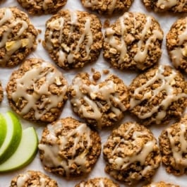 apple cinnamon oatmeal cookies with icing on top.