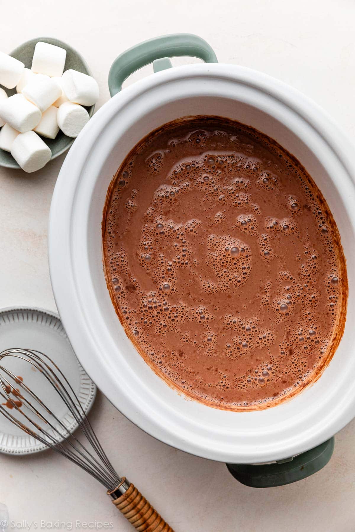 hot cocoa pictured in a slow cooker.