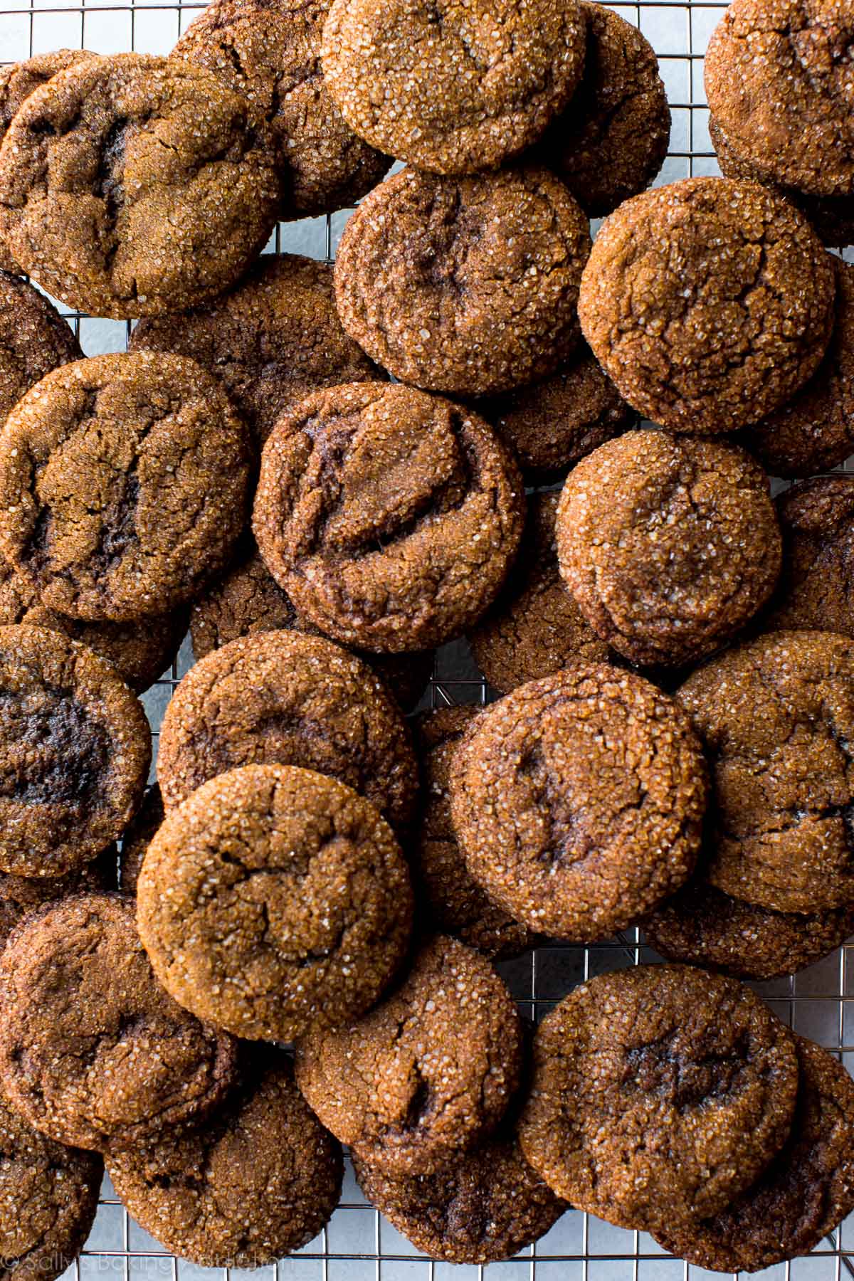 overhead image of crisp molasses cookies on a cooling rack