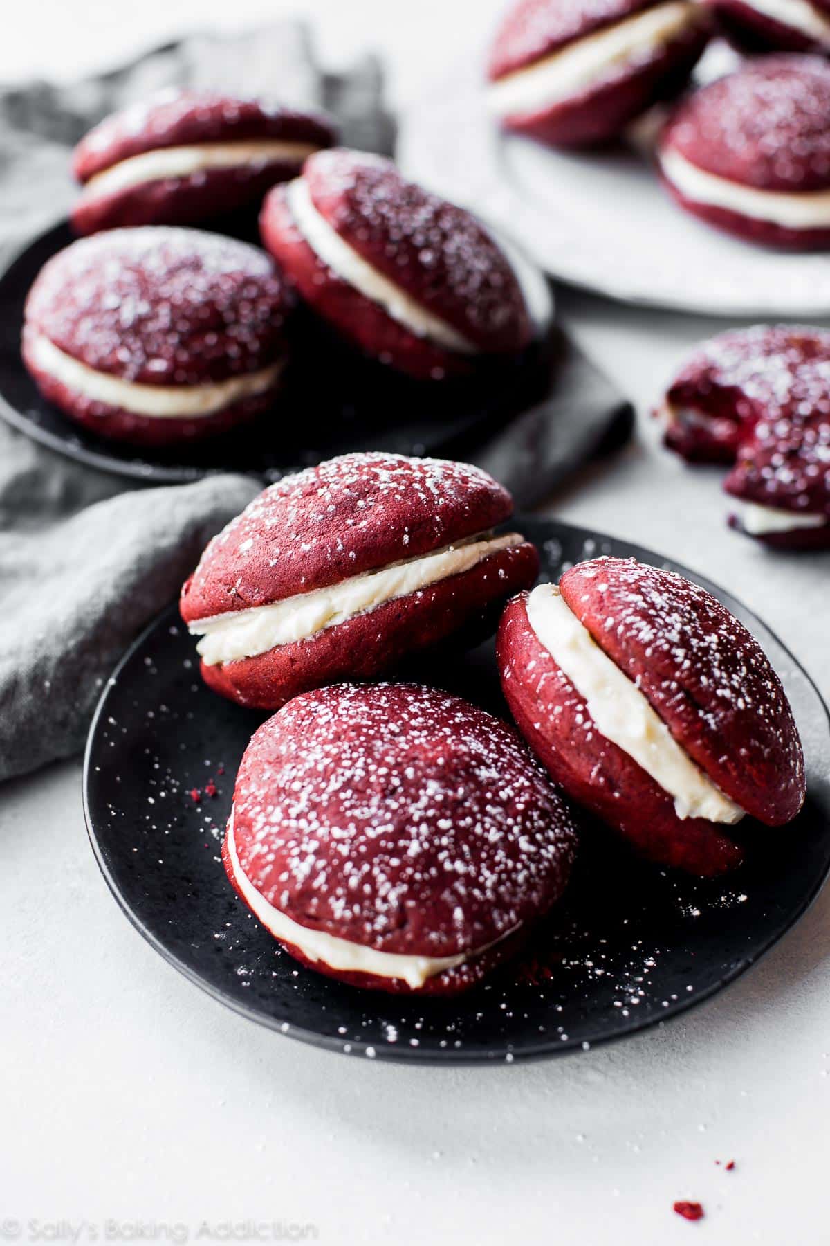 red velvet whoopie pies on a black plate