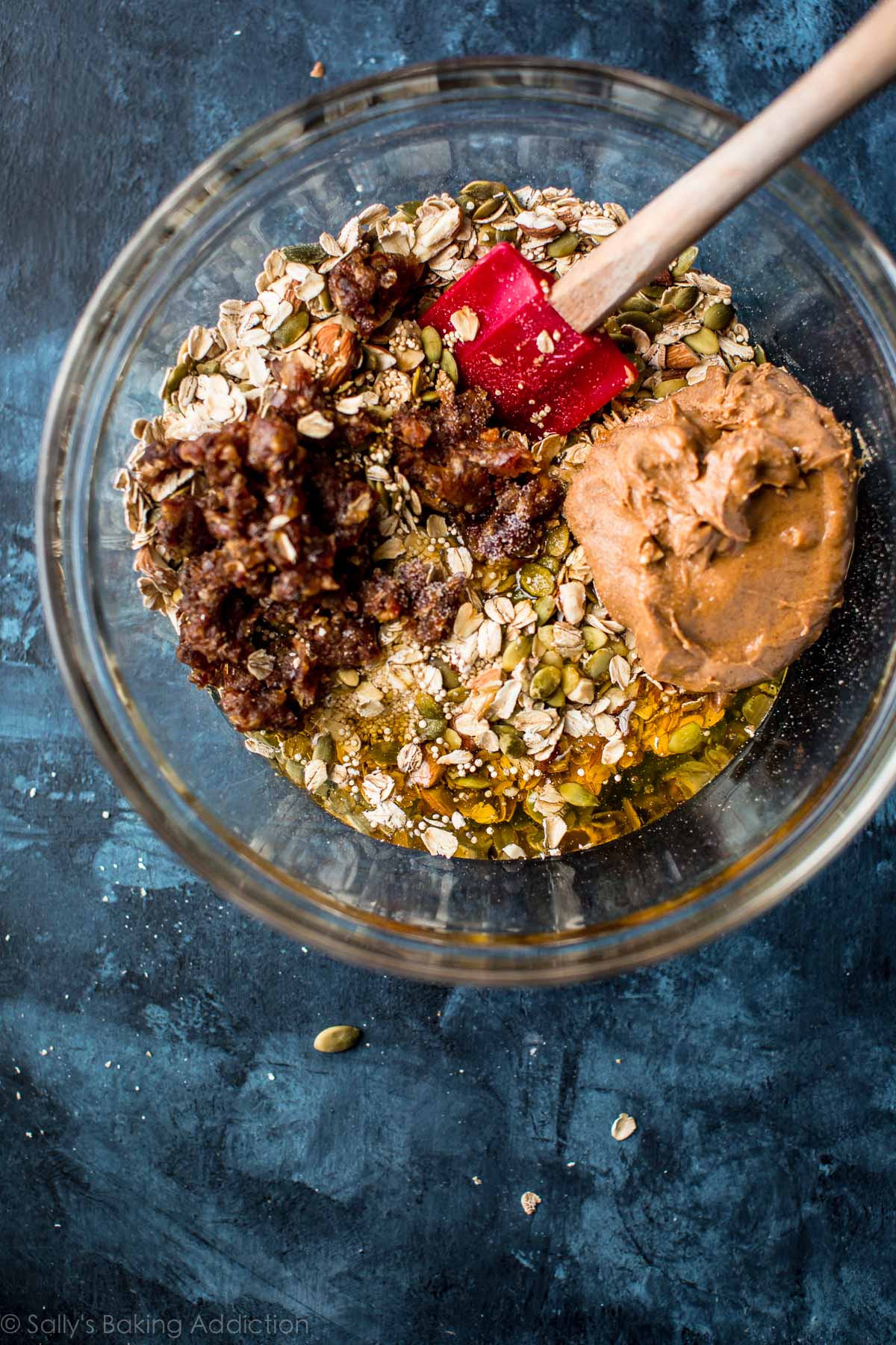 ingredients for snack bars in a glass bowl with a spatula