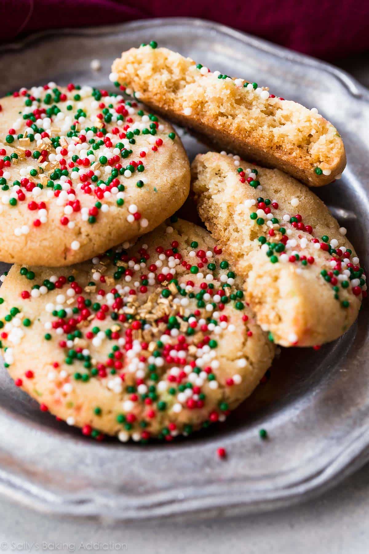 brown butter sugar cookies with Christmas sprinkles on a silver plate