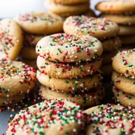stacks of brown butter sugar cookies with Christmas sprinkles
