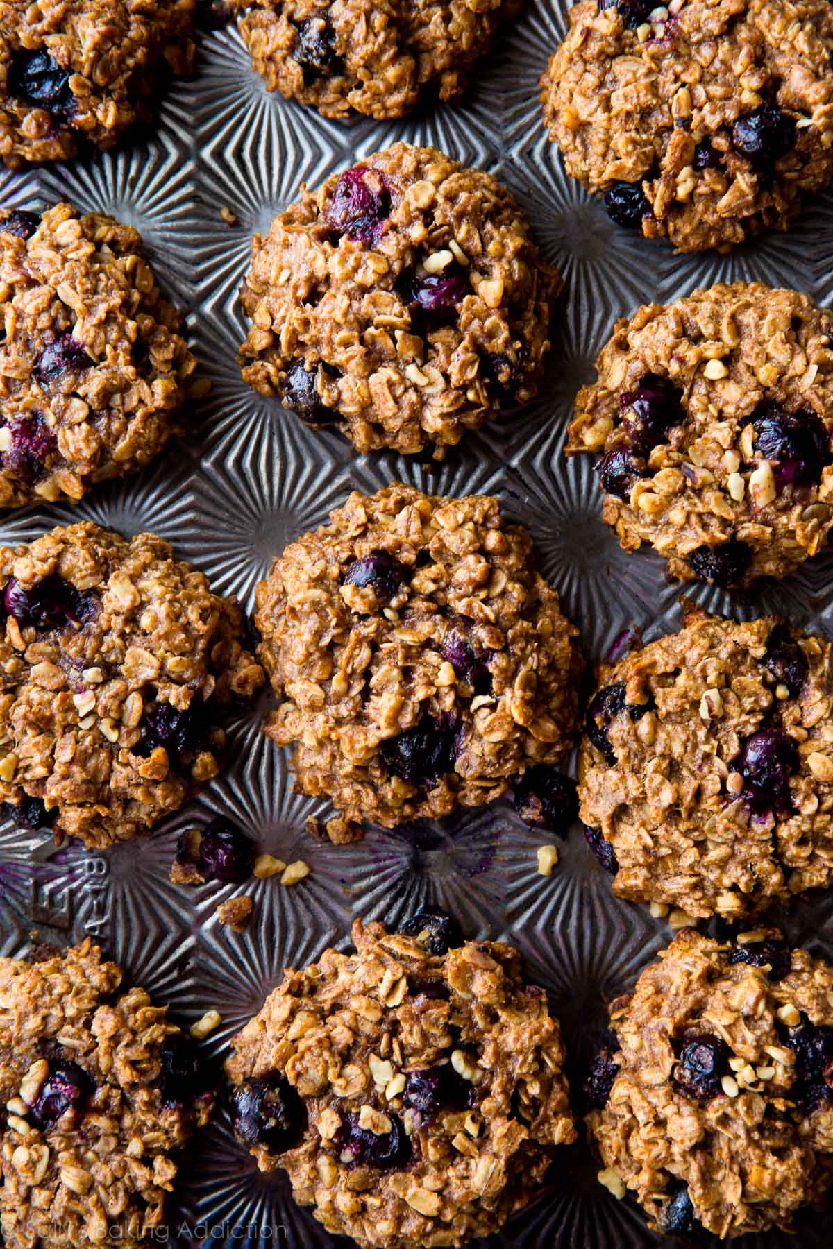 overhead image of blueberry breakfast cookies on a baking sheet