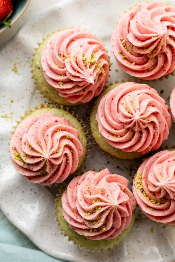 strawberry frosting piped on cupcakes.