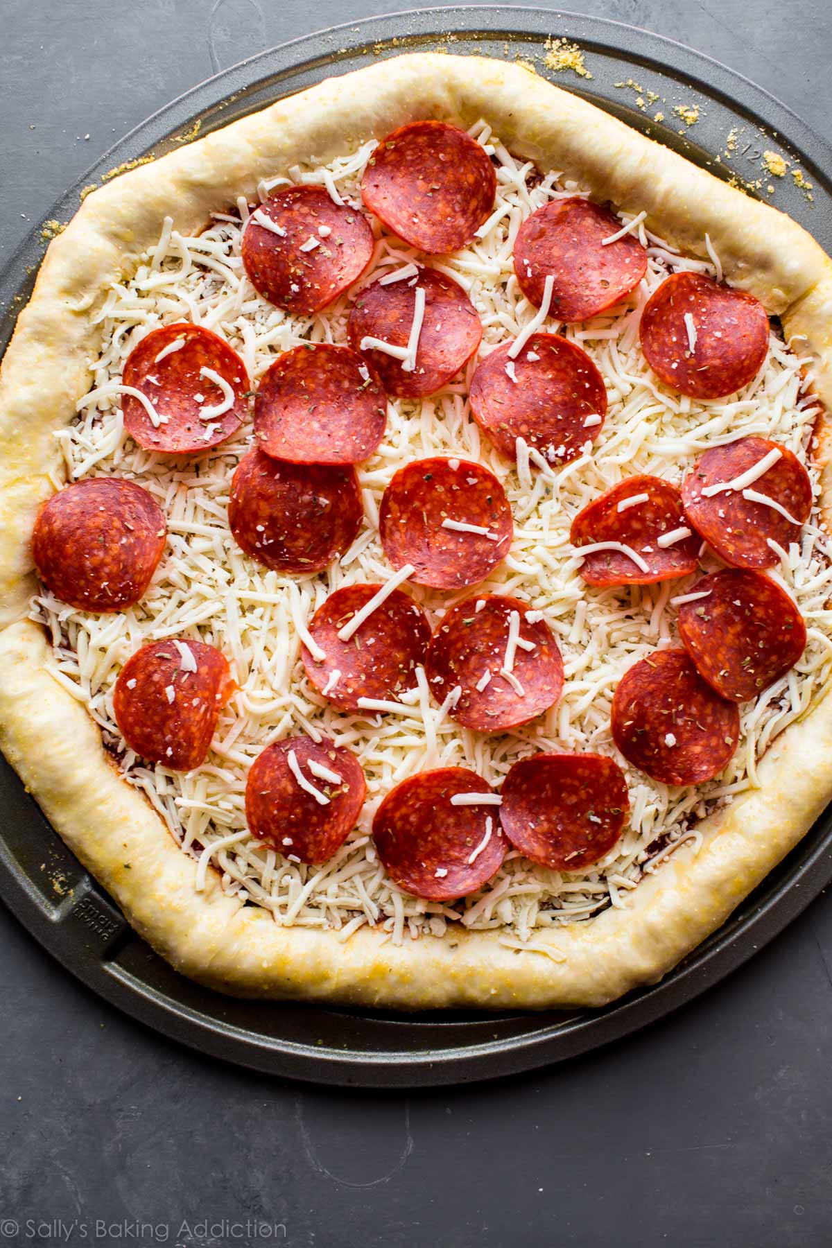 stuffed crust pizza before baking on a pizza pan