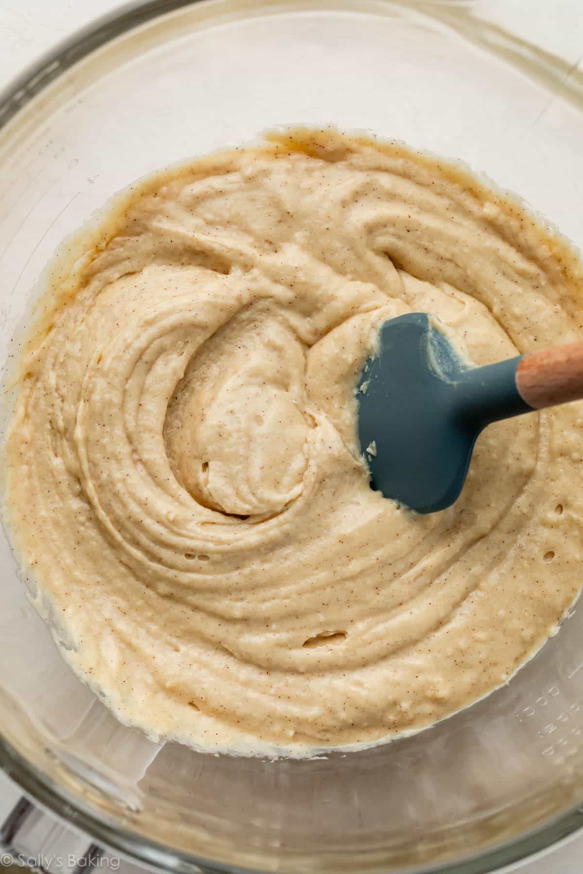 batter in glass bowl with blue spatula.