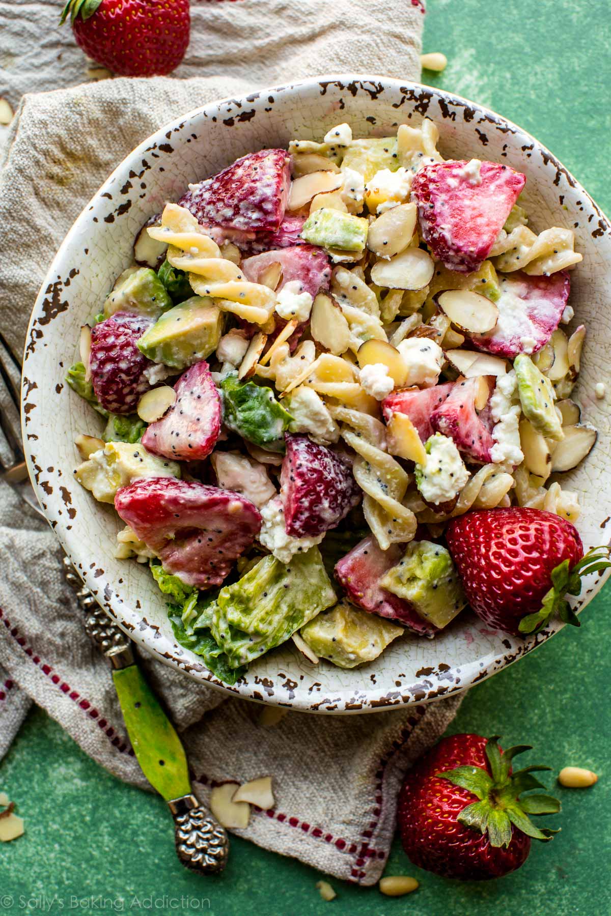strawberry feta pasta salad in a ceramic bowl