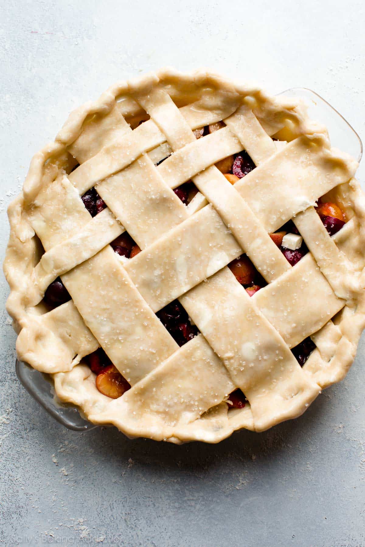 cherry pie with lattice pie crust before baking