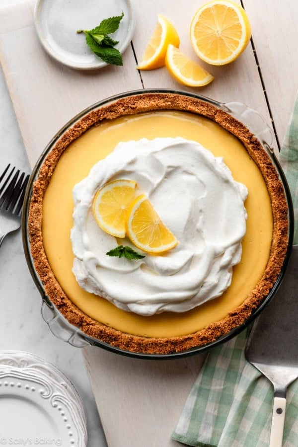 creamy lemon pie with whipped cream and graham cracker crust.