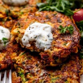 sweet potato zucchini fritter with forkful removed.