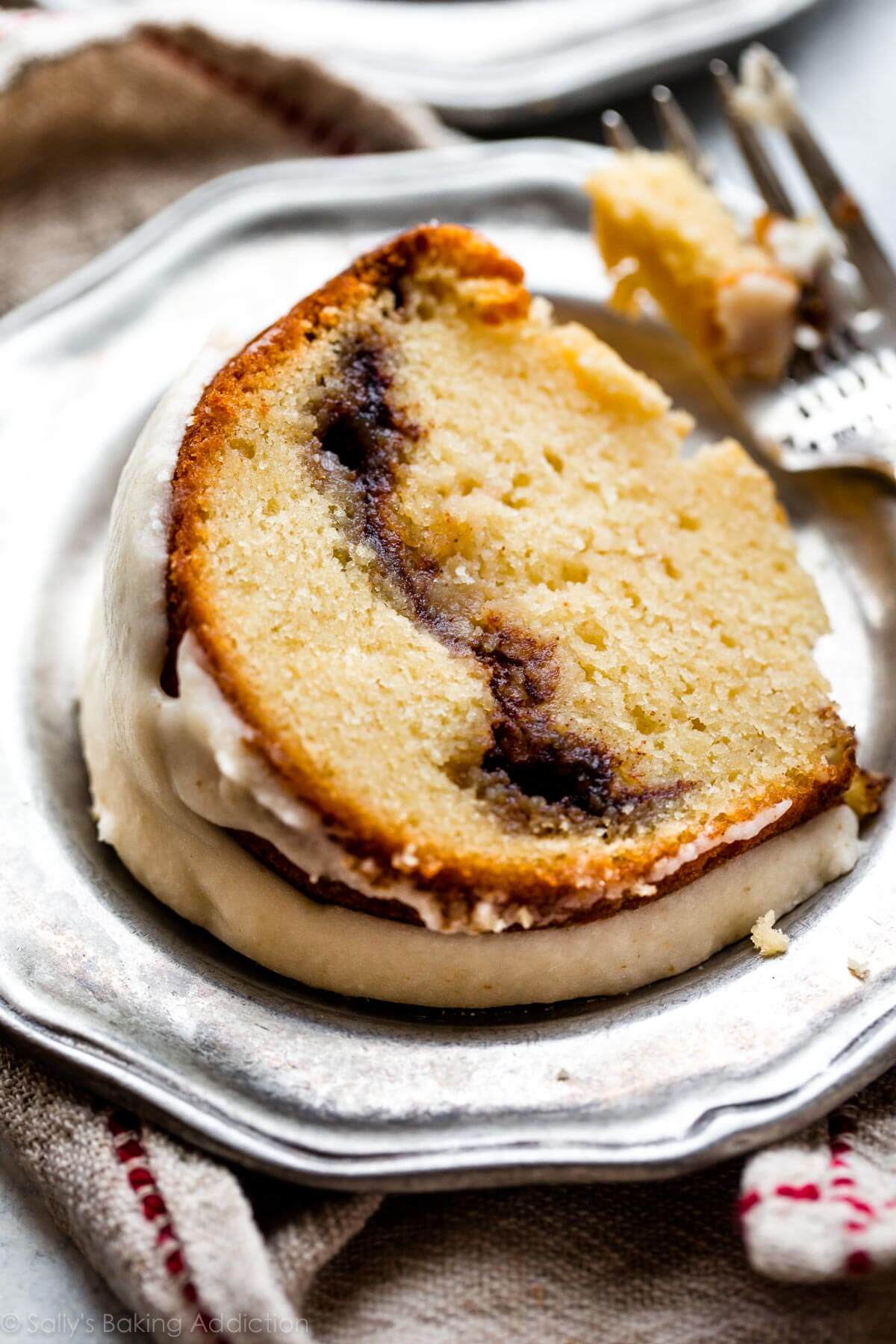 slice of chai cinnamon swirl bundt cake on a silver plate