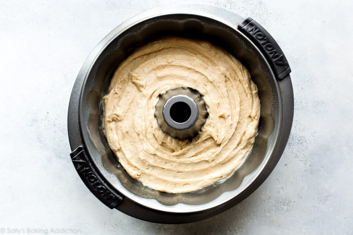 layer of cake batter in the bottom of a bundt cake pan