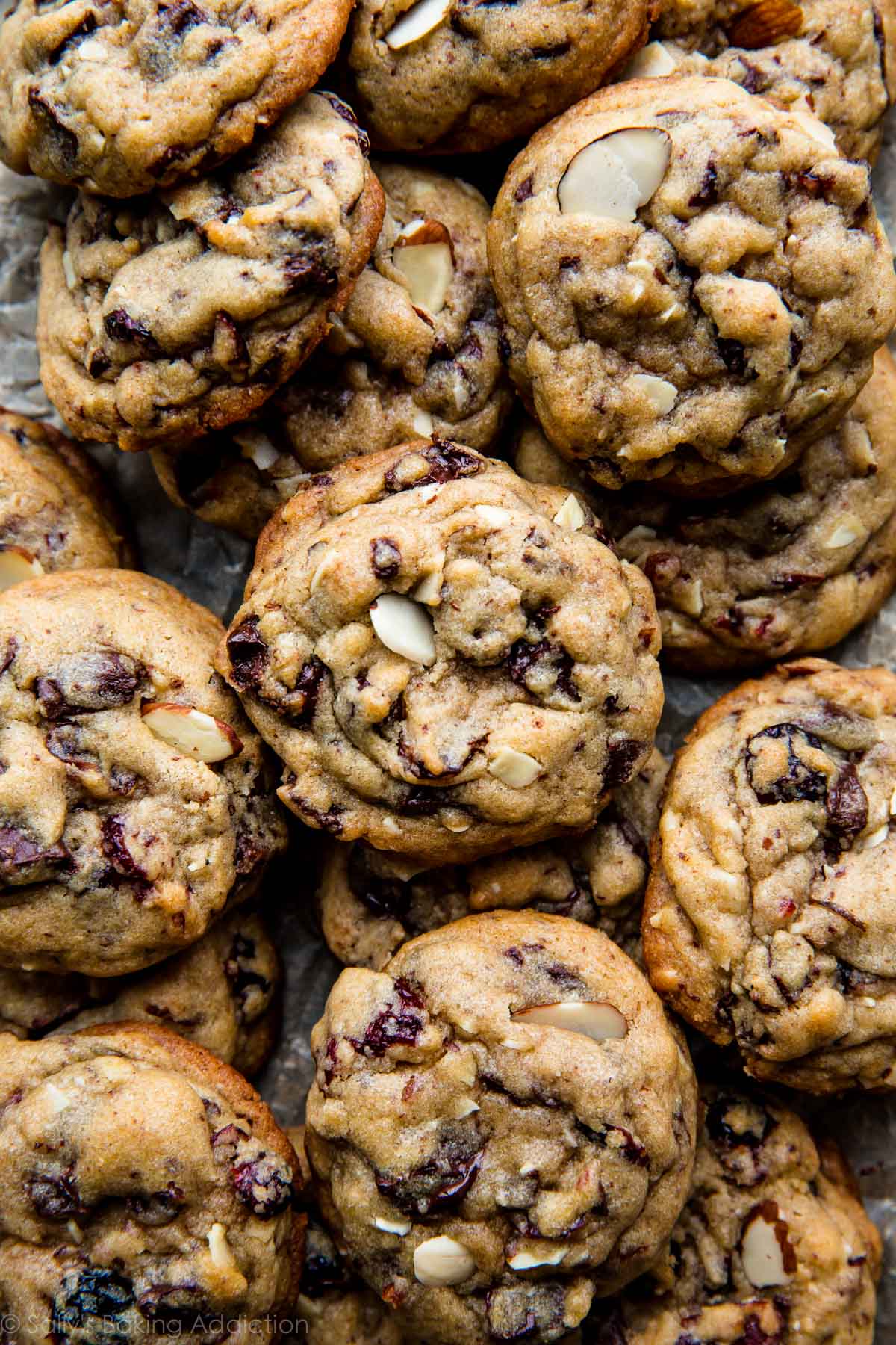 overhead image of dark chocolate cranberry almond cookies