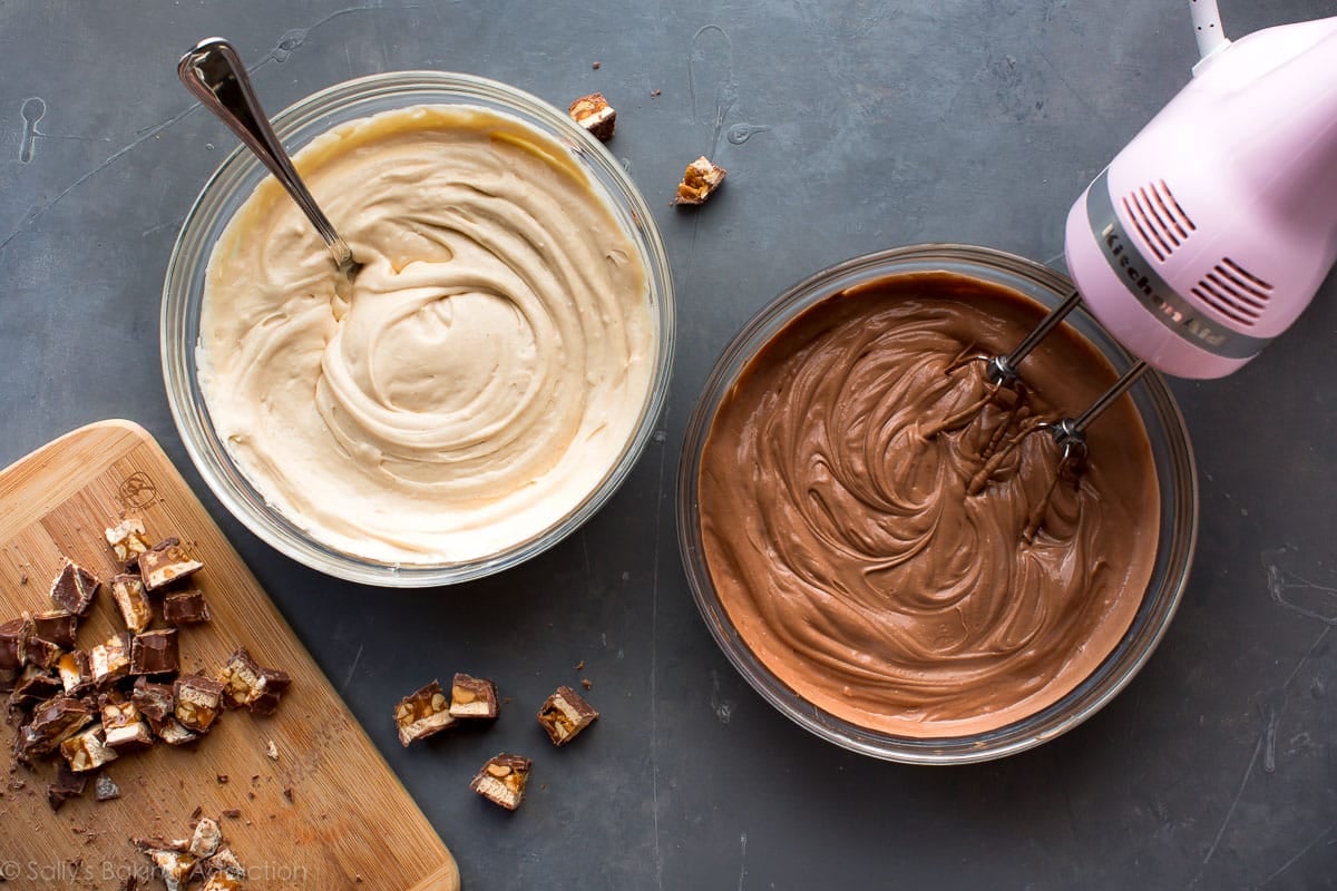 peanut butter cheesecake batter and chocolate cheesecake batter in glass bowls