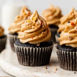 dark chocolate cupcake with peanut butter frosting and Reese's Pieces.