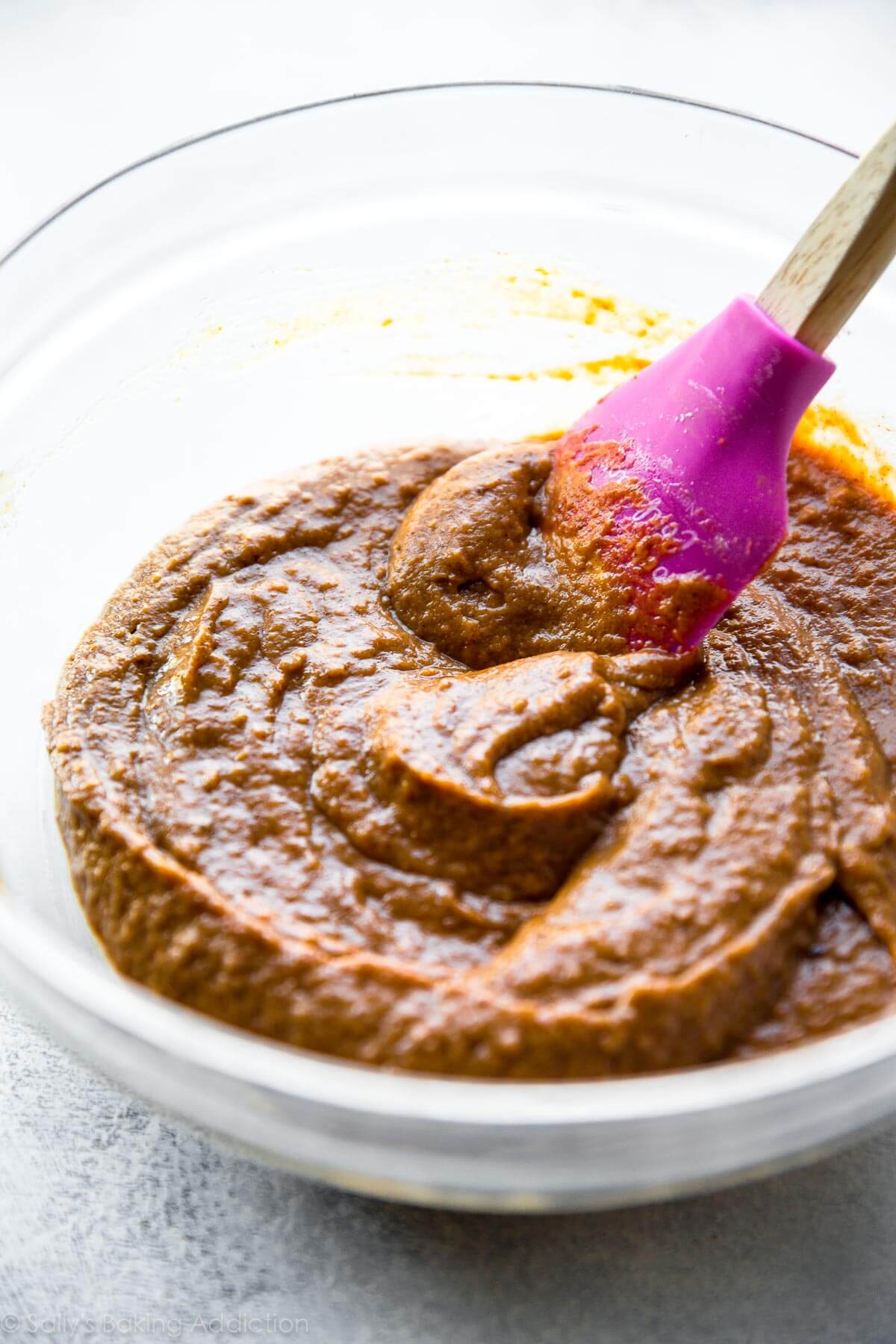 pumpkin cupcake batter in a glass bowl