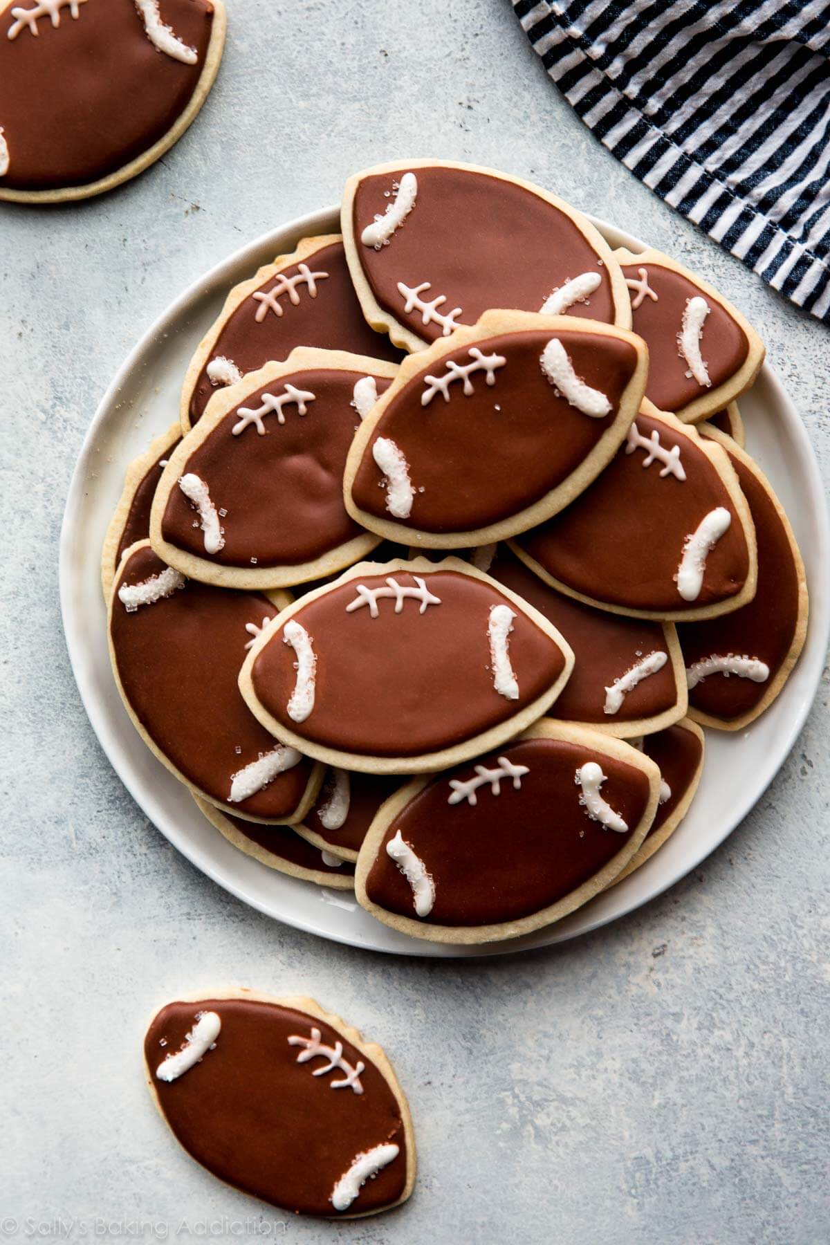 football sugar cookies on a white plate