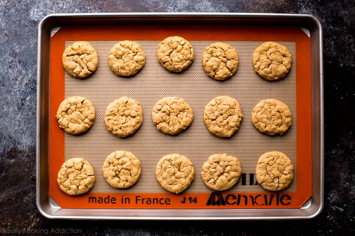 peanut butter cookies on a baking sheet after baking