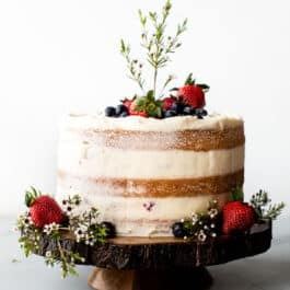 Rustic naked cake on a wood slice cake stand