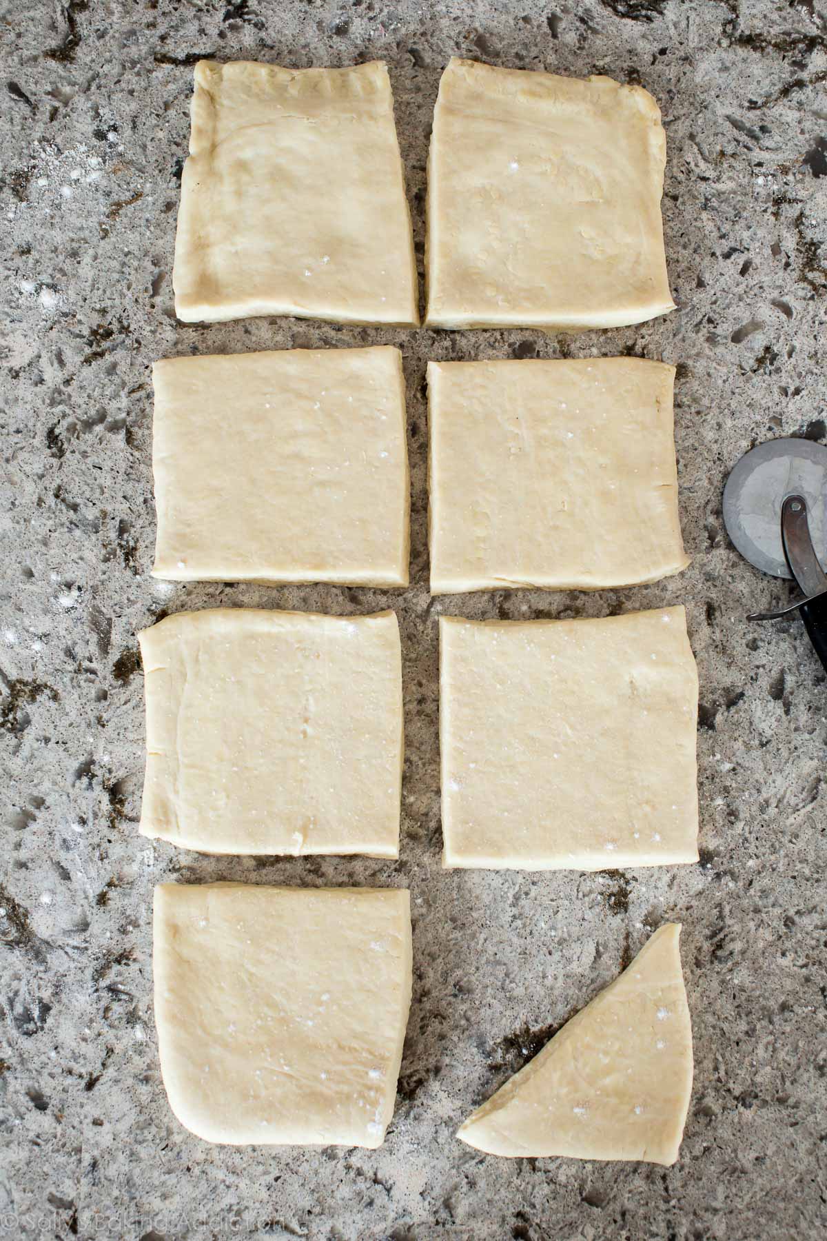 croissant dough rolled out and cut into squares