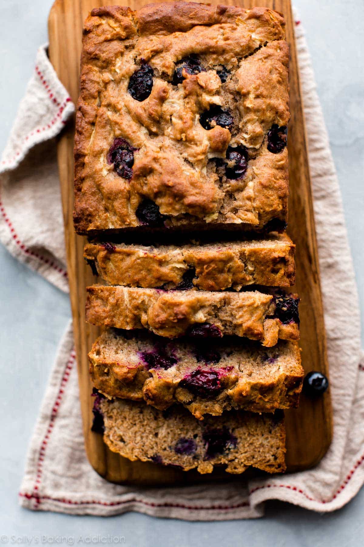 overhead image of a sliced loaf of Greek yogurt apple blueberry bread