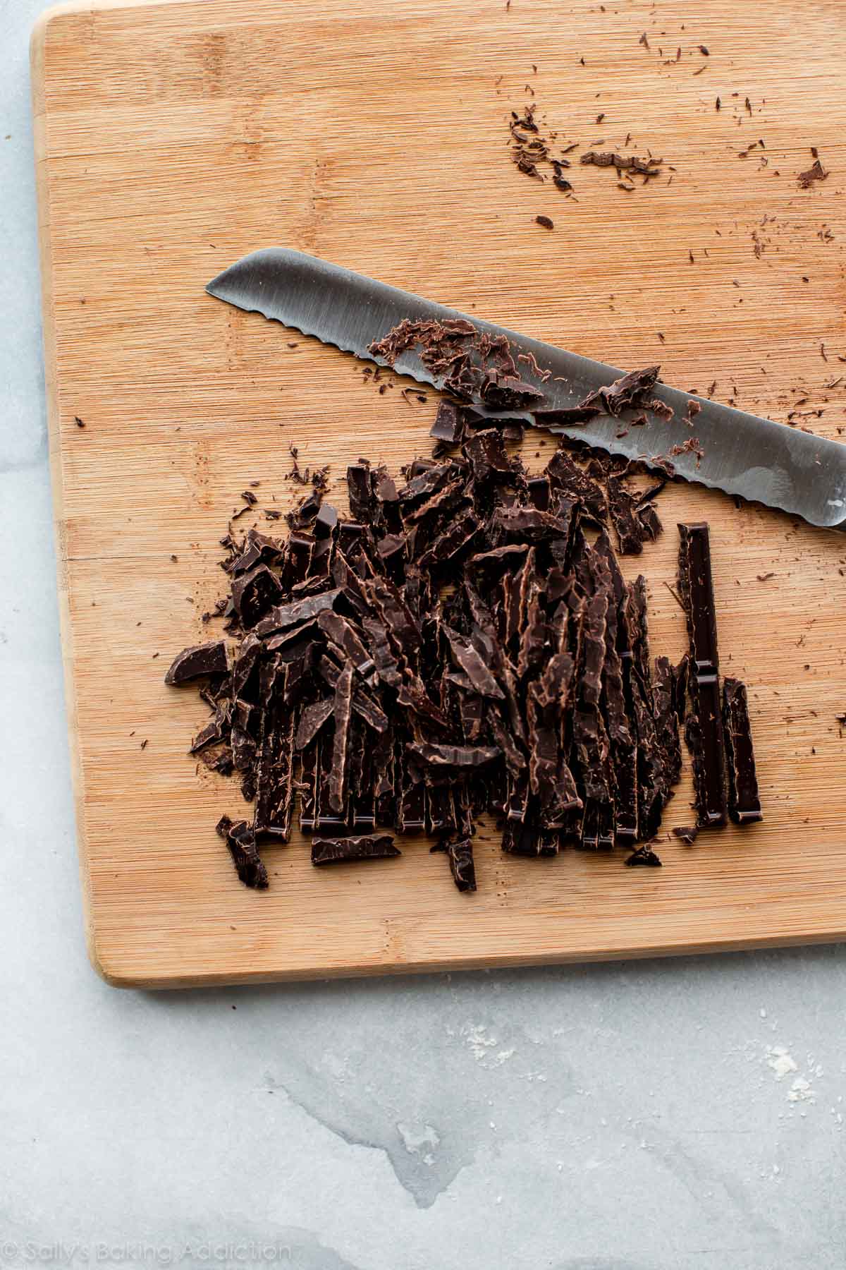 chopped chocolate on a wood cutting board