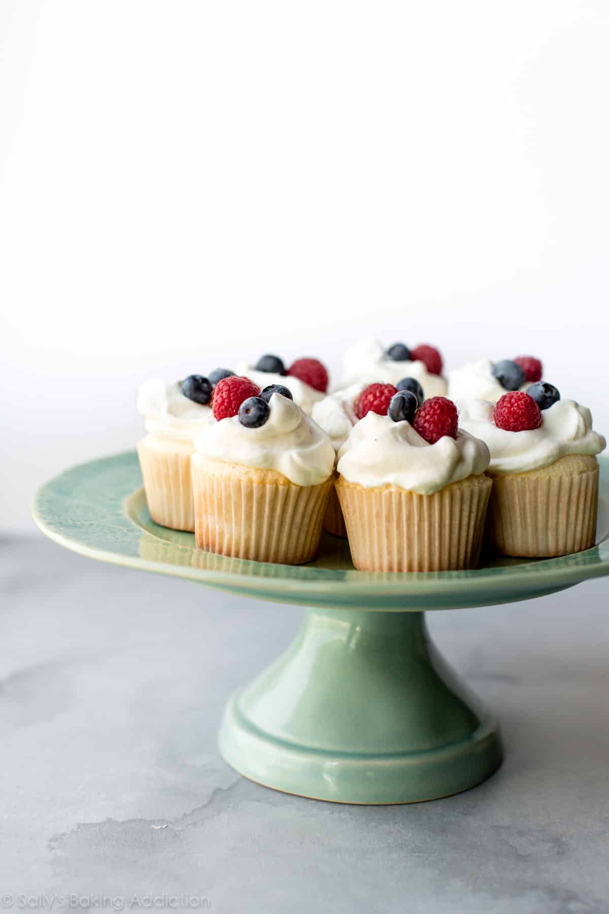 angel food cupcakes on teal cake stand
